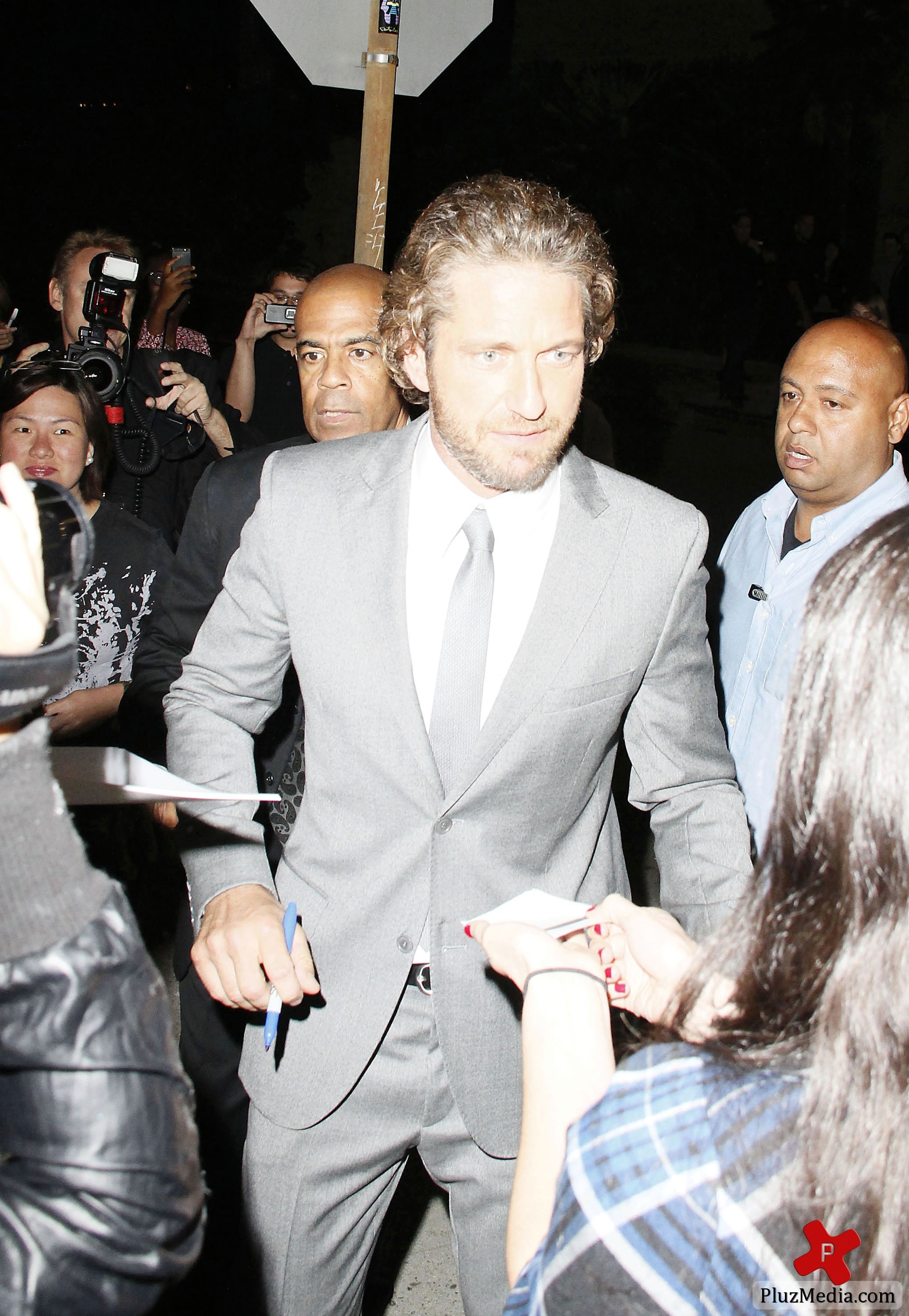 Gerard Butler signs autographs for fans at the 'Machine Gun Preacher' premiere | Picture 84218